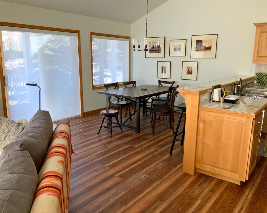 wood look flooring in kitchen with wood cabinets 